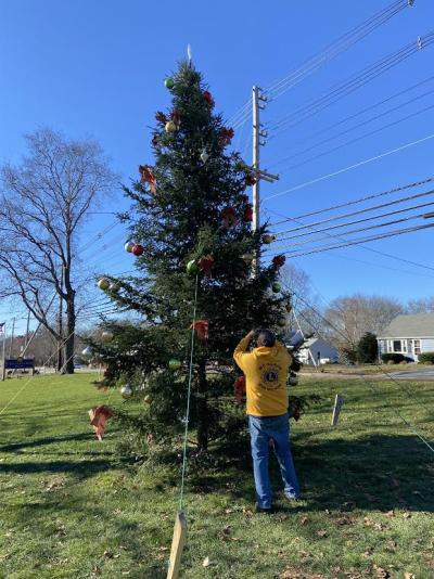 The Lakeville Lions installed their tree the weekend of Nov. 26 and finalized preparations for the annual tree lighting. State Representative Norm Orrall donated the tree, which was installed by Gary and Peter Loranger of Beaver Tree Works. Dave Rose of Dave's Autobody donated his tractor for the effort. Photo courtesy: Lakeville Lions Club