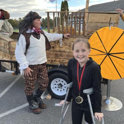 Sophie Lamere at the Lakeville Lions’ trick or treat wheel run by Mark Dube at the 2023 Halloween Trunk or Treat event in Lakeville. Dube is a member of the Lakeville Lions. Photo by Emma Rindlisbacher