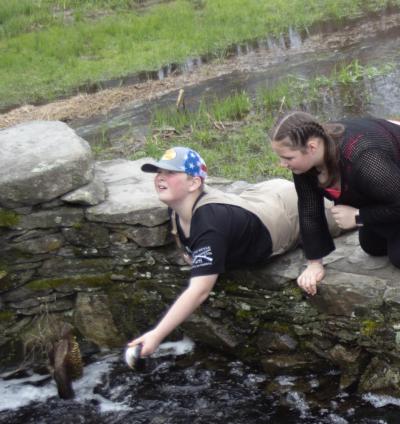 Shane DaPonte, left, catches a herring while his sister, Hope DaPonte, looks on. Photo by Anna Milton