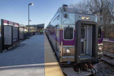 A bi-level commuter rail coach at the Freetown station during a ribbon-cutting event. Source: Massachusetts Bay Transportation Authority