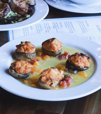 🦞 Lobster Mushrooms
Tender mushroom caps filled with lobster, topped with tomato concassé & buttery scampi sauce.