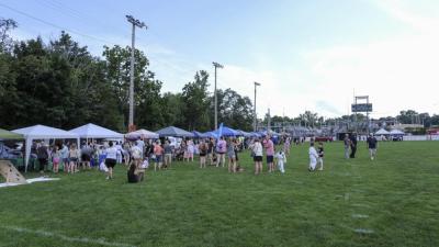 Booths from area youth sports teams, community groups and nonprofits lined the football field at Battis Field.