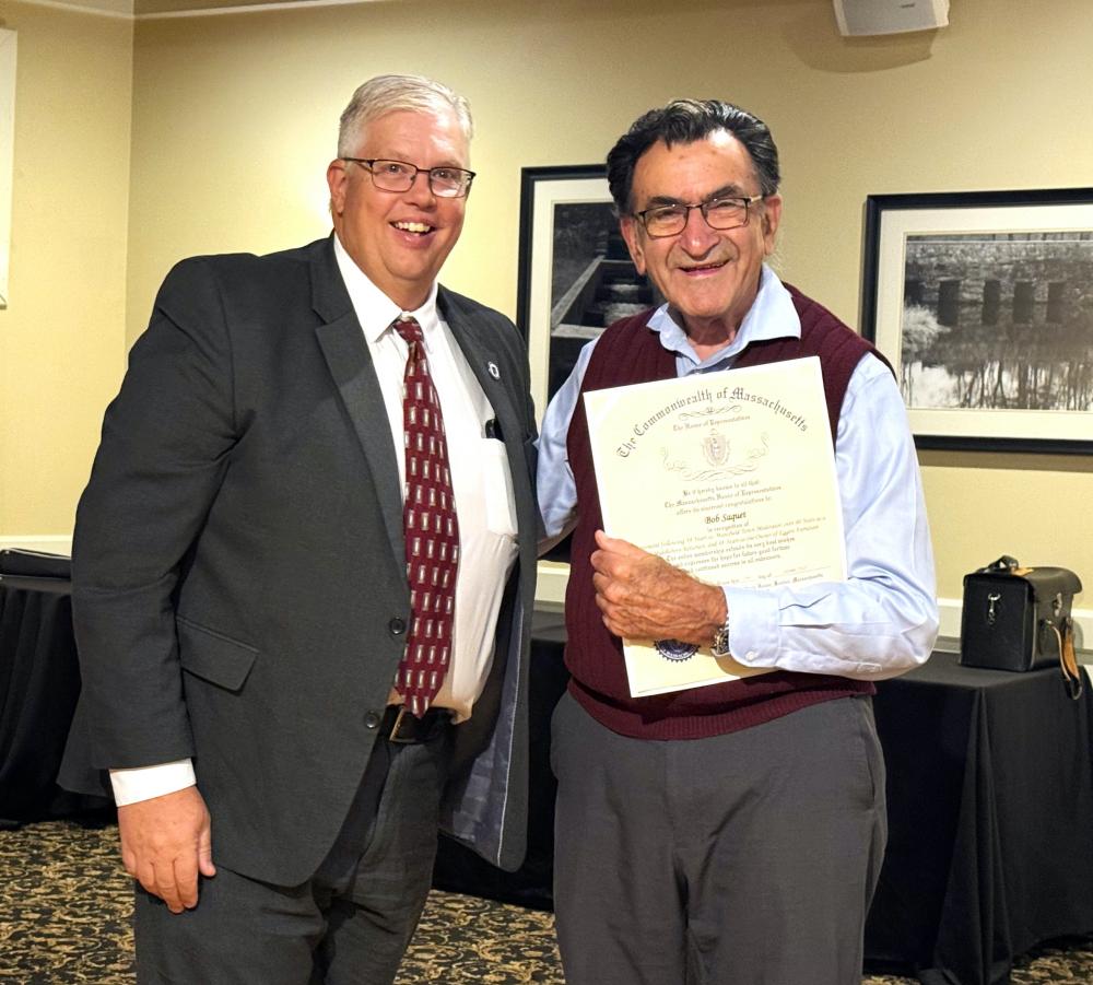 State Rep. Norman J. Orrall presents Bob Saquet with an award from the Massachusetts House of Representatives at a recent surprise retirement celebration. Photo source: Middleboro-Lakeville Rotary Club NONE