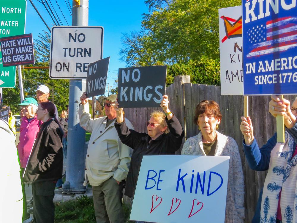 A group of protesters hold signs at the No Kings protest in Middleboro Oct. 18. Photos by Grace Roche A group of protesters hold signs at the No Kings protest in Middleboro Oct. 18.