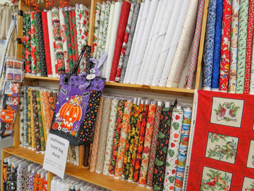 Seasonal fabrics cover a shelf of the store. Seasonal fabrics cover a shelf of the store.