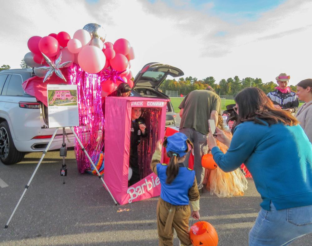 A family stops for a photo at the Barbie-themed Jack Conway table. A family stops for a photo at the Barbie-themed Jack Conway table.