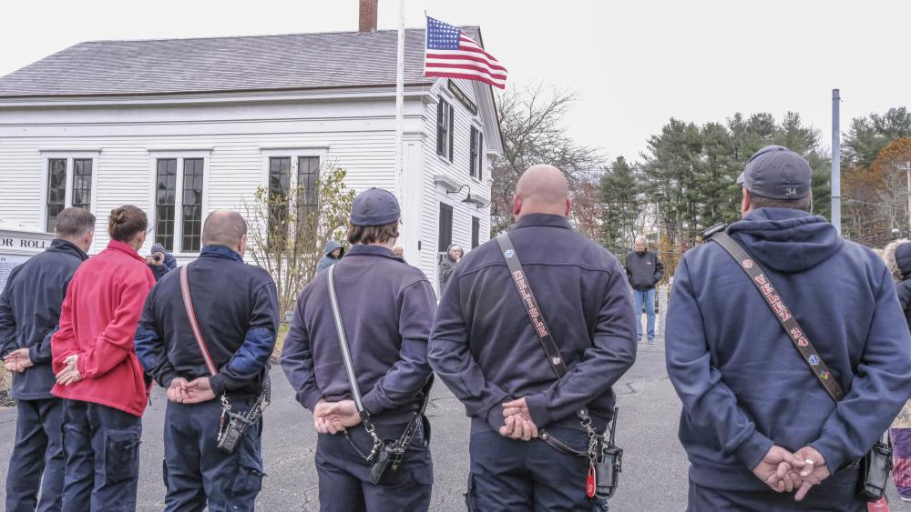 The crowd listens to speakers at the Historic Town Hall in Lakeville.