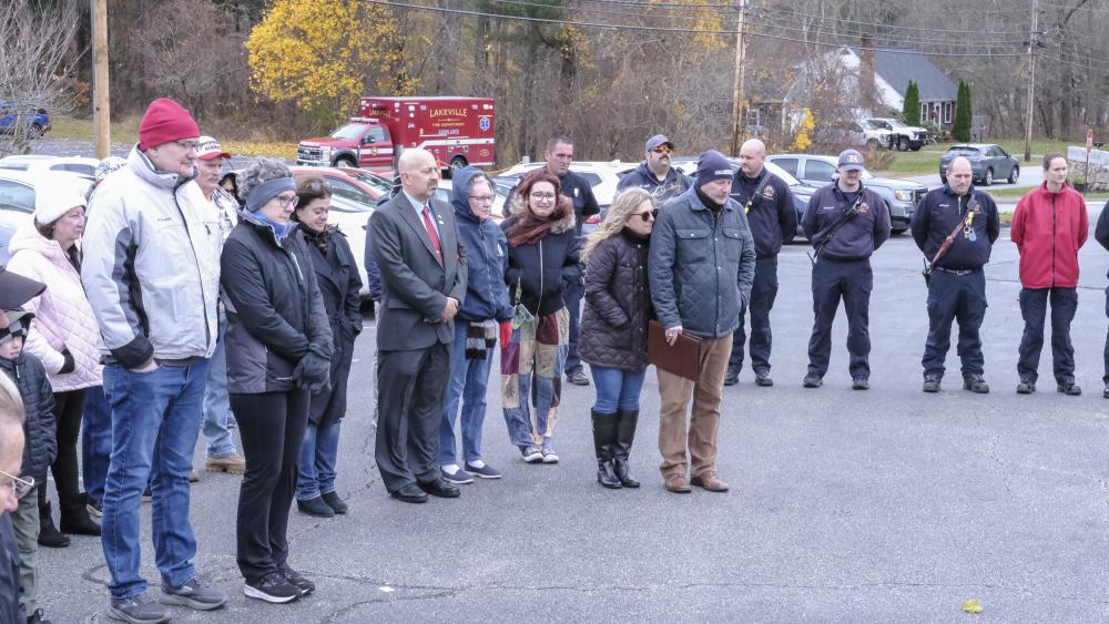 The crowd listens to speakers at the Historic Town Hall in Lakeville.