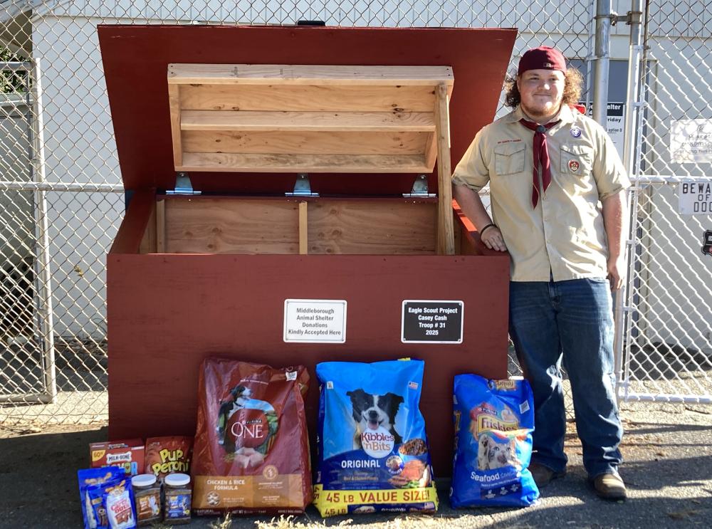 Casey Cash stands beside the new donation bin he built for the Middleboro Animal Shelter. Photo source: Troop 31