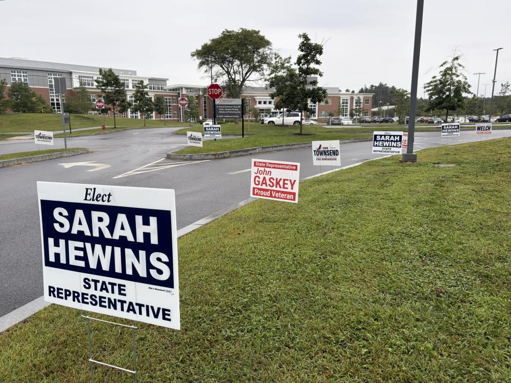 Signs for state representative candidates near Middleboro High School, one of the town's three polling locations. Photo by Christian Uva
