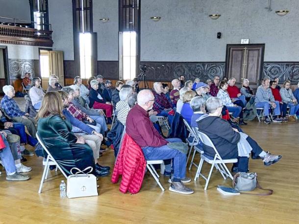 A crowd of attendees listen to a live-musical performance at a previous Sunday Concert Series. 