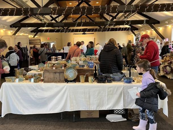 Shoppers browse goods at a past holiday craft fair. Photo source: Lakeville Arts Council