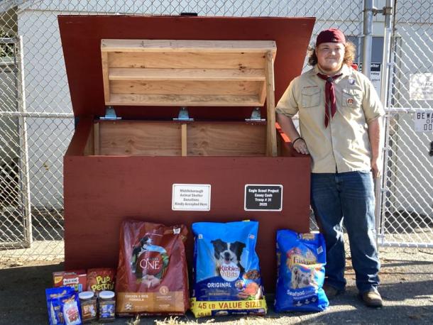 Casey Cash stands beside the new donation bin he built for the Middleboro Animal Shelter. Photo source: Troop 31