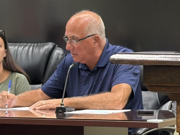 Robert Nunes signs his contract at the Sept. 14 Middleboro Select Board meeting. Photo by Christian Uva