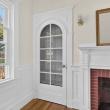 Original arched glass-paned door beside the fireplace in Unit 1, 370 Maple Street, New Bedford