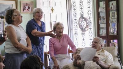 Left to right: Delia Murphy, Geri Taylor, Irene Fernandes and Daniel Fernandes joke as they discuss the cane award.