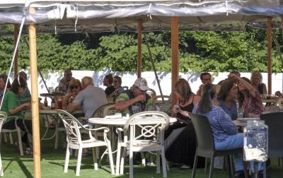 Patrons dine in the outdoor area at Lorenzo’s Restaurant and Bar.
