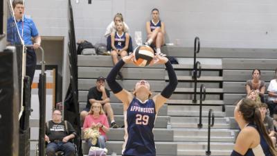A Lakers player sets the ball for a team mate.