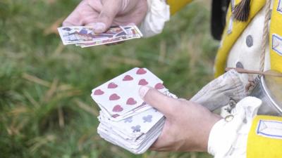 Dunbar displays playing cards that were often carried by soldiers to pass the time. NONE