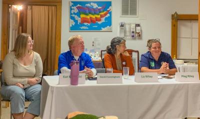 The four speakers sit together as attendees ask questions following their presentations.  The four speakers sit together as attendees ask questions following their presentations.