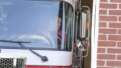 Robert Clemens eyes a sideview mirror while he parks. NONE