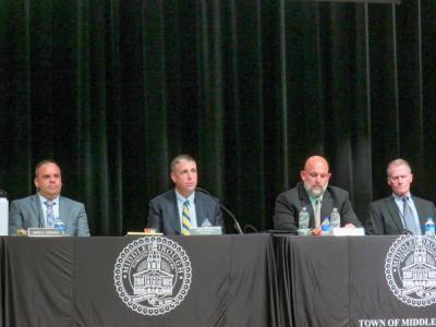 Members of the Select Board and Town Manager James McGrail at the Special Town Meeting. Members of the Select Board and Town Manager James McGrail at the Special Town Meeting.
