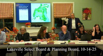 Lloyd Geisinger stands behind the Select Board during his senior housing proposal at the Oct. 14 meeting. 