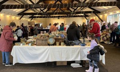 Shoppers browse goods at a past holiday craft fair. Photo source: Lakeville Arts Council