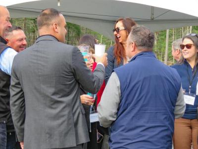Attendees, including Dooner (center), toast after the ceremony. 