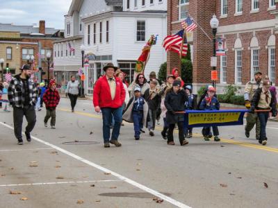 The Middleboro Cub Scout troop walks through downtown Middleboro. Photo by Grace Roche