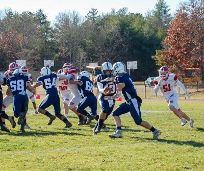 Sean Lundrigan takes the ball for a run.