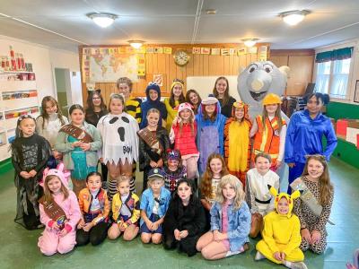 Middleboro Girl Scouts pose together during their Trick or Treat So Others Can Eat event Saturday, Oct. 25.