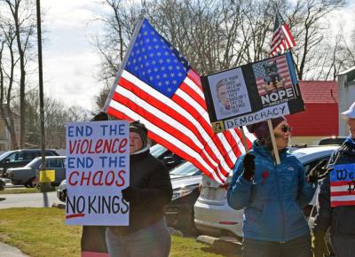 Protesters with the American flag behind them.