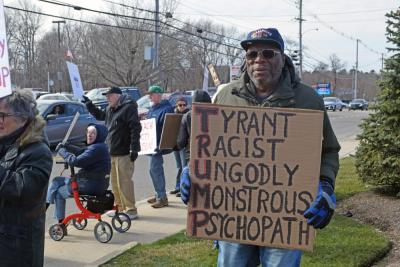 A man shows his 'Trump' acrostic poem.
