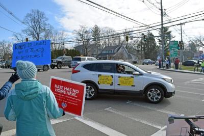 A car driving past shows its support.
