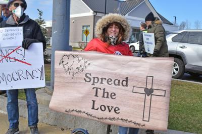 A woman's sign calls for love.