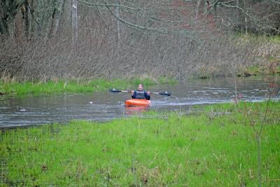 Brenda Velantzas raises her oar in success. 