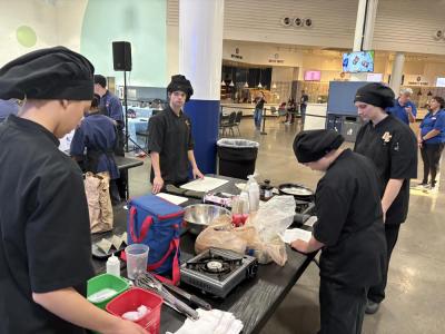 Old Colony students set up for competition at the Johnson Space Center during the NASA HUNCH culinary challenge. Photo source: Ashley Ulett