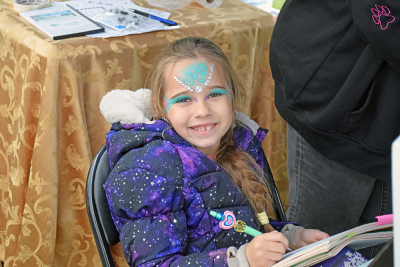 Mari Reis Stavovy shows off her face paint. 