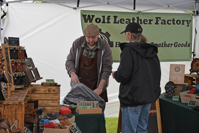 A vendor shows a potential customer his product. 