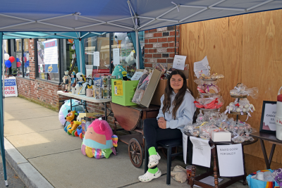 Autumn manning a booth.