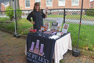 Janet Olivera advertising a new nail salon.