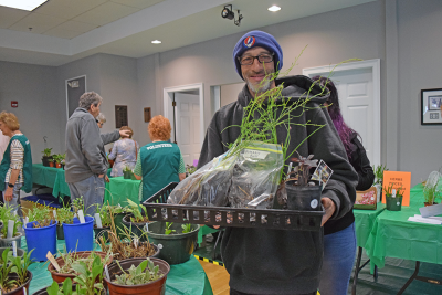 People of all ages joined in at the Oak Point sale to get some plants. 