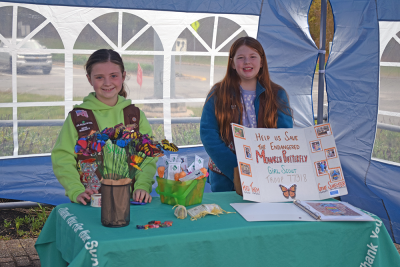 Ariella Heche and Kinsley Cooper, both age 8, promoted helping monarch butterflies at the Lakeville plant sale. 