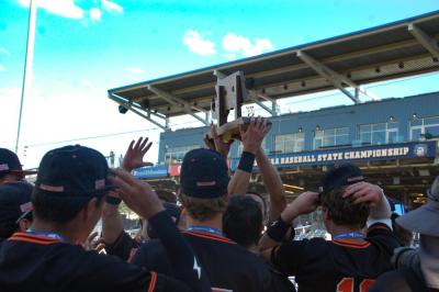 Middleboro players hold up their trophy. 