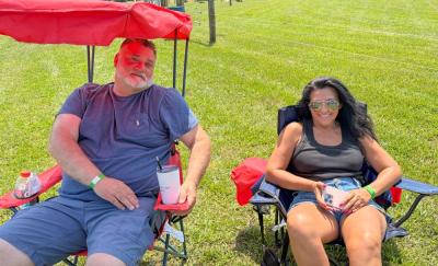 Peter Freitas and Liz Tiago relax on the lawn. 