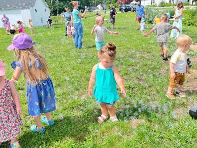 Sophia Lovell, 2, points out some bubbles. Photo by Christian Uva