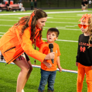 From Left: Kindergarten teacher Carly Paling and students Collin Bertram and Willow Norvish speak during the Middleboro meet at the 50 event. 