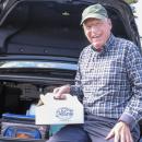 Known as the “Candyman”, Lakeville resident Fred Reagan poses with a box of candy bars. He has sold over 150,000 candy bars to fund cancer research at the Dana-Farber Cancer Institute. Photos by Sam Tucker NONE