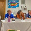 The four speakers sit together as attendees ask questions following their presentations.  The four speakers sit together as attendees ask questions following their presentations.